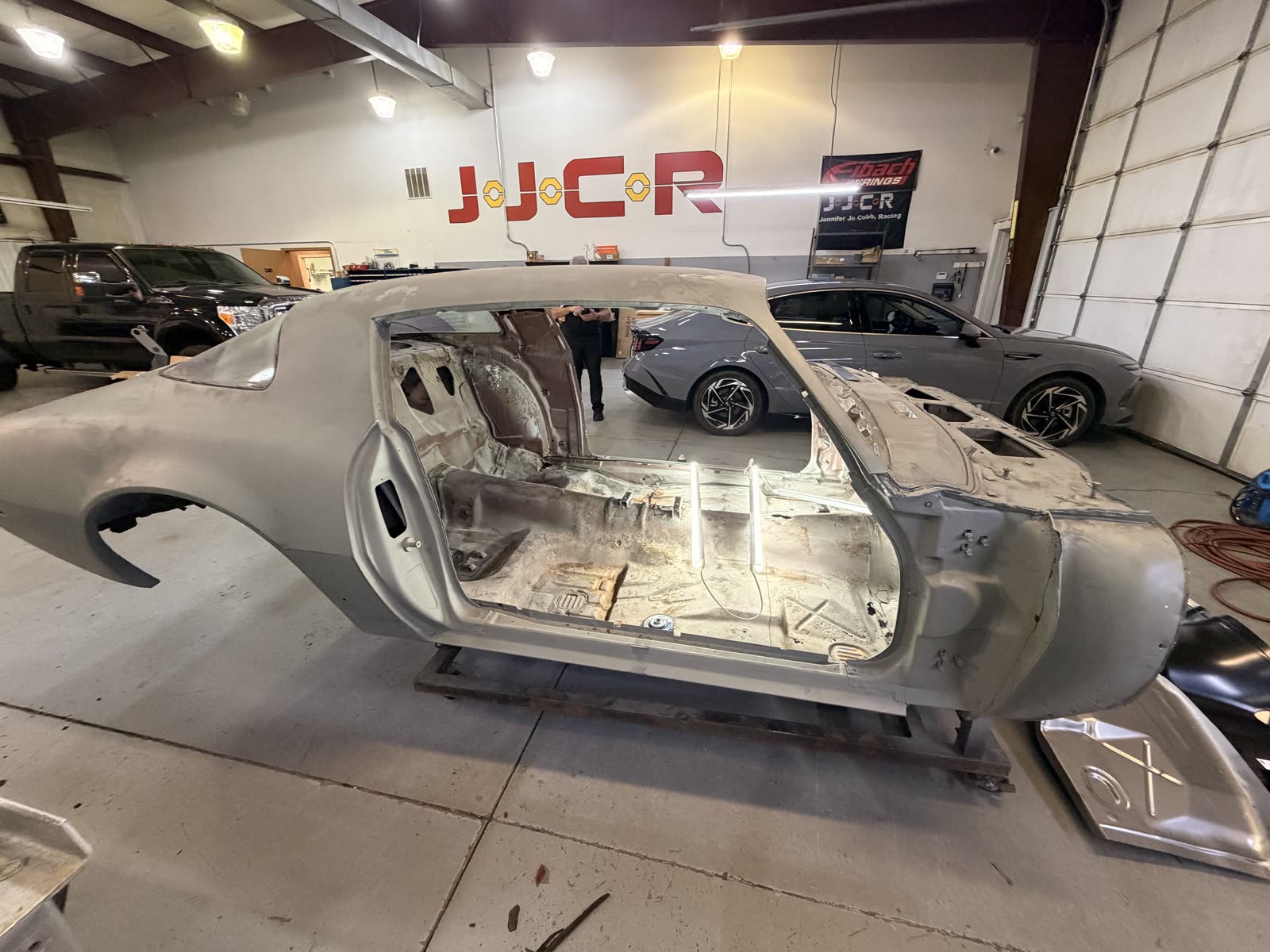 The Firebird shell on its dolly in the shop